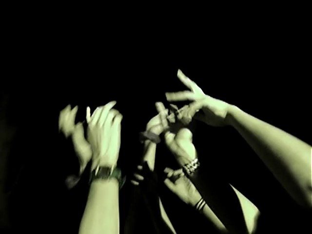 Video Reference: hands, arms, crowd, dark background, raised hands, gesture, concert, audience, green tint, movement