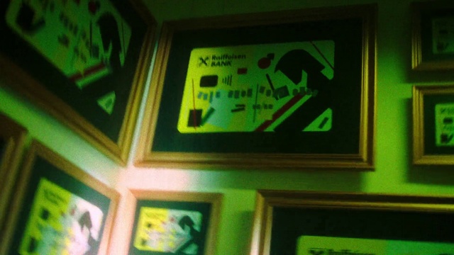 Video Reference: Green, Font, Snapshot, Electronic device, Recreation, Machine, Room, Picture frame, Display device, Visual arts