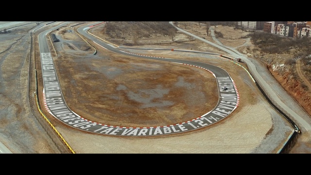 Video Reference: Road surface, Asphalt, Urban design, Wood, Art, Landscape, Circle, Road, Pattern, Metal