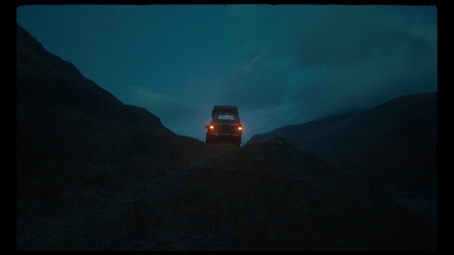 Video Reference: Land vehicle, Vehicle, Sky, Car, Automotive lighting, Cloud, Automotive tire, Tire, Mountain, Automotive exterior