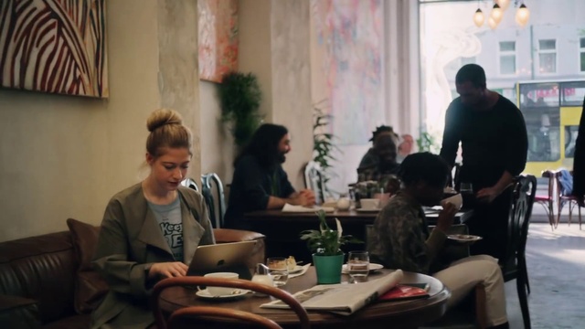Video Reference: Furniture, Plant, Table, Laptop, Chair, Interaction, Houseplant, Jacket, Event, T-shirt