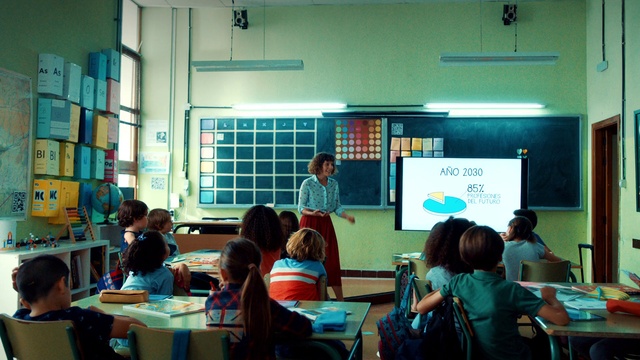 Video Reference: Table, Furniture, Chair, Desk, Building, Academic institution, Adaptation, Teacher, Event, Class