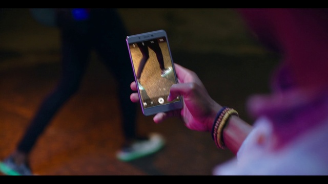 Video Reference: Purple, Sleeve, Gesture, Communication Device, Street fashion, Gadget, Magenta, Wrist, Entertainment, Jewellery
