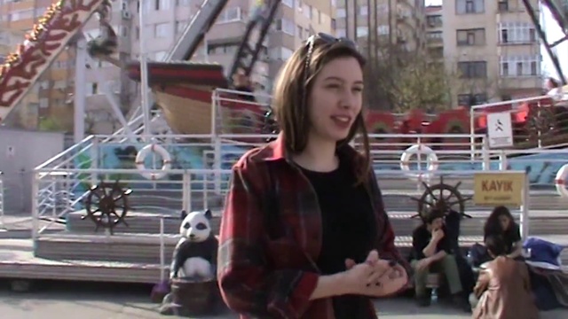 Video Reference: Smile, Fun, Leisure, Tree, Recreation, Travel, Event, Street fashion, T-shirt, Pedestrian