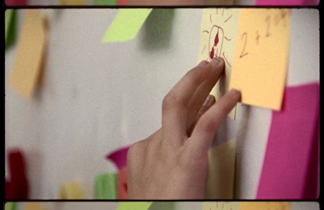 Video Reference: Gesture, Yellow, Finger, Creative arts, Art, Rectangle, Triangle, Wood, Font, Nail