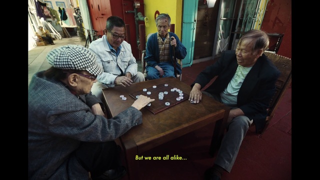 Video Reference: Outerwear, Shirt, Table, Coat, Sharing, Interaction, Desk, Jacket, Recreation, Adaptation