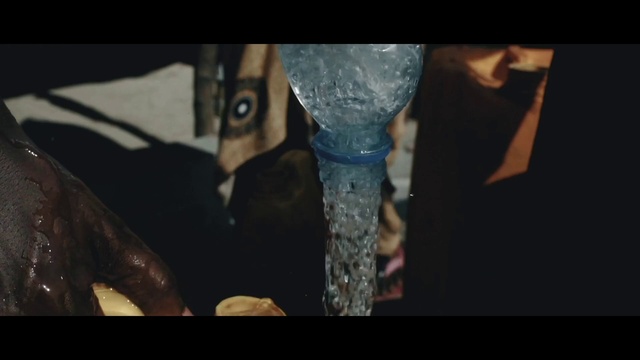 Video Reference: Flash photography, Jaw, Automotive tire, Gesture, Bumper, Knee, Font, Thigh, Elbow, Wood