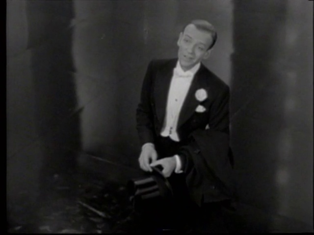 Video Reference: Gesture, Collar, Suit, Blazer, Art, Flash photography, Formal wear, Event, Monochrome photography, Monochrome