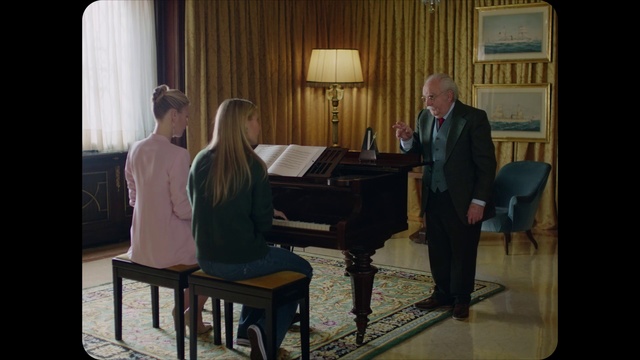 Video Reference: Trousers, Piano, Keyboard, Musical instrument, Couch, Curtain, Pianist, Musician, Event, Electronic device