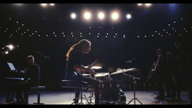 Video Reference: Microphone, Band plays, Musical instrument, Membranophone, Idiophone, String instrument, Cymbal, String instrument, Musical instrument accessory, Musician