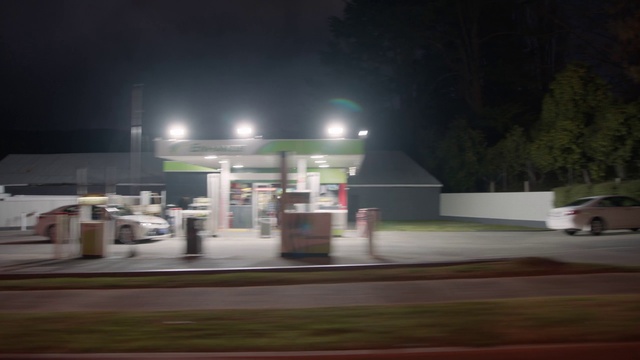 Video Reference: Gas pump, Automotive lighting, Filling station, Gasoline, Asphalt, Road surface, Sky, Fuel, Electricity, Gas