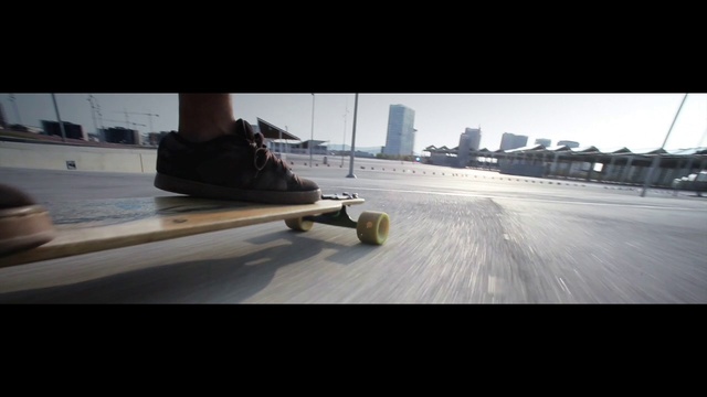 Video Reference: Automotive tire, Asphalt, Road surface, Rolling, Sky, Wood, Tire, Flooring, Tints and shades, City