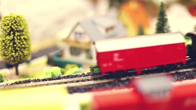 Video Reference: Train, Land vehicle, Rolling stock, Plant, Track, Building, Toy, Railway, Railroad car, Rolling