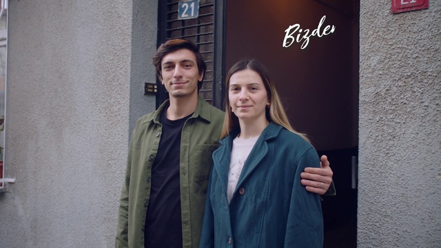 Video Reference: Smile, Outerwear, Fashion, Flash photography, Sleeve, Standing, Blazer, Happy, Fashion design, Formal wear