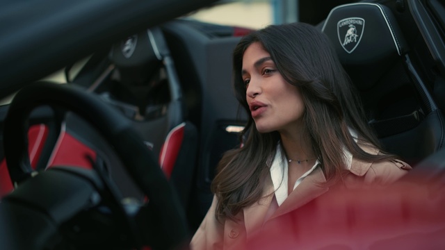 Video Reference: Lip, Vehicle, Car, Automotive design, Automotive lighting, Motor vehicle, Automotive mirror, Lipstick, Flash photography, Steering wheel