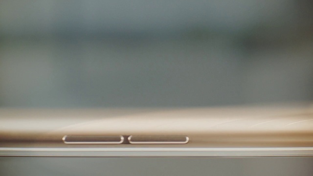Video Reference: Communication Device, Gadget, Wood, Beige, Metal, Portable communications device, Font, Macro photography, Rectangle, Display device