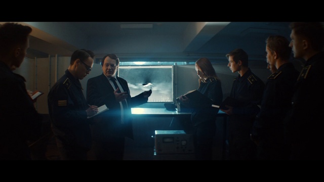 Video Reference: Coat, Gesture, Suit, Cloud, Event, White-collar worker, Display device, Flash photography, Sky, Formal wear