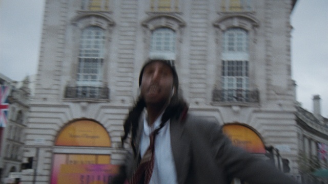 Video Reference: Window, Building, Travel, Blazer, Facade, Suit, Formal wear, Event, City, Beard