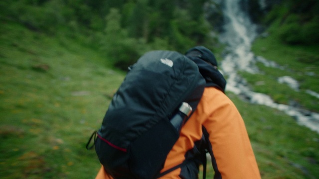 Video Reference: Water, Outdoor recreation, Grass, Bag, Backpack, Recreation, Personal protective equipment, Grassland, Luggage and bags, Landscape