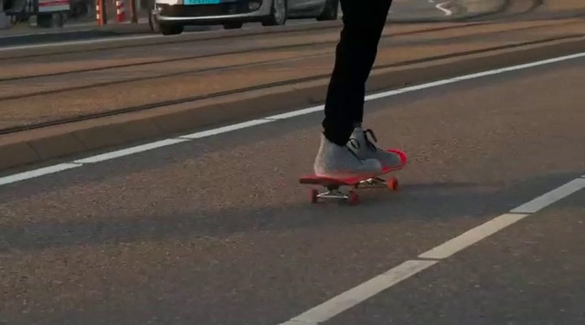 Video Reference: Footwear, Jeans, Shoe, Sports equipment, Leg, Wheel, Road surface, Asphalt, Kickflip, Outdoor recreation