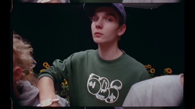 Video Reference: Chin, Gesture, Flash photography, Cap, Cool, T-shirt, Baseball cap, Sun hat, Elbow, Event