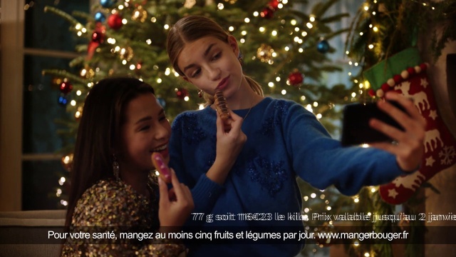 Video Reference: Christmas tree, Facial expression, Light, Christmas ornament, Smile, Lighting, Happy, Gesture, Plant, Flash photography