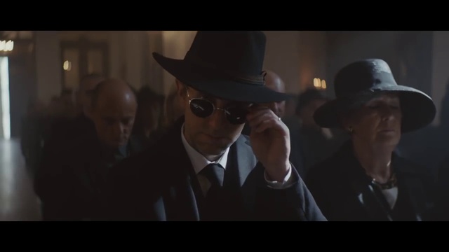 Video Reference: Vision care, Hat, Flash photography, Sun hat, Gesture, Eyewear, Fedora, Headgear, Blazer, Event