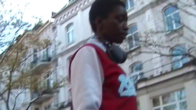 Video Reference: Window, Building, Temple, Sky, Travel, Street fashion, T-shirt, Wall, Facade, Art