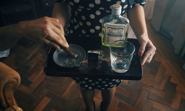 Video Reference: Hand, Bottle, Drinkware, Liquid, Fluid, Drink, Alcoholic beverage, Tartan, Eyewear, Flash photography