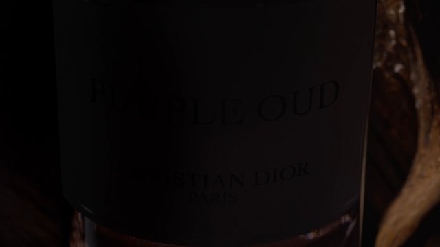 Video Reference: bottle, label, close-up, dark, shadows, reflection, drink, glass, packaging, product, low-light