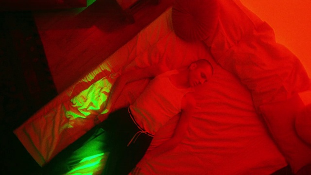 Video Reference: Textile, Sleeve, Orange, Automotive lighting, Magenta, Comfort, Room, Human leg, Pattern, Event