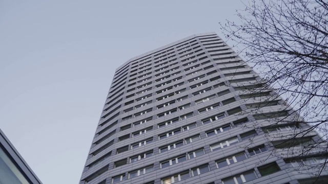 Video Reference: Building, Sky, Skyscraper, Urban design, Tower block, Condominium, Material property, Tree, Commercial building, Facade