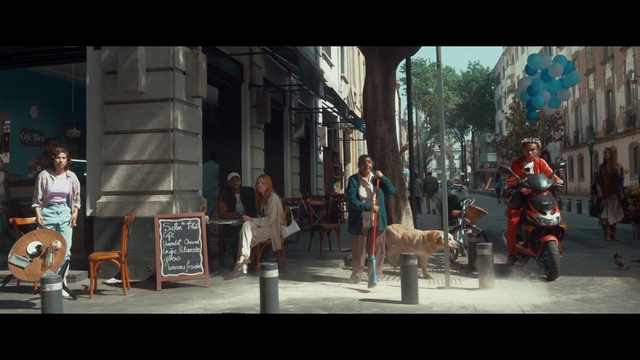 Video Reference: Wheel, Tire, Shorts, Tree, Street fashion, Road, City, Sidewalk, Leisure, Pedestrian