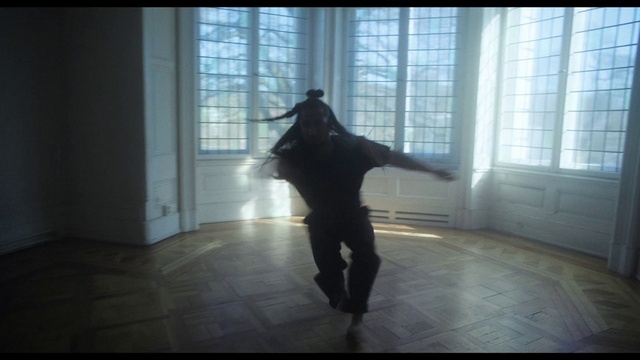 Video Reference: Outerwear, Window, Flooring, Tints and shades, Art, Darkness, Wood, Personal protective equipment, Shadow, Backlighting