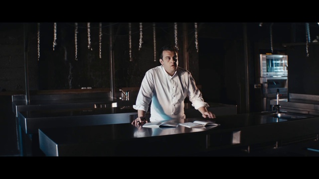 Video Reference: Dress shirt, Flash photography, Sleeve, Entertainment, Table, Event, White-collar worker, Curtain, Fashion design, Performing arts