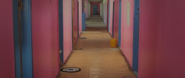 Video Reference: Door, Building, Pink, Wall, Wood, Flooring, Fixture, Magenta, Tints and shades, Symmetry