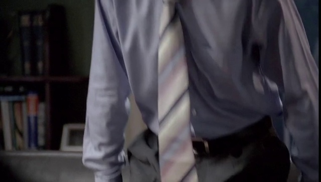 Video Reference: Dress shirt, Bookcase, Sleeve, Shelf, Grey, Collar, Waist, Sportswear, Thigh, Comfort