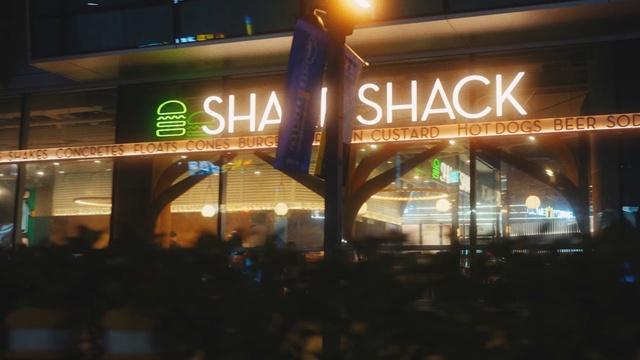 Video Reference: Building, Font, Event, Electronic signage, Signage, Midnight, City, Facade, Logo, Neon