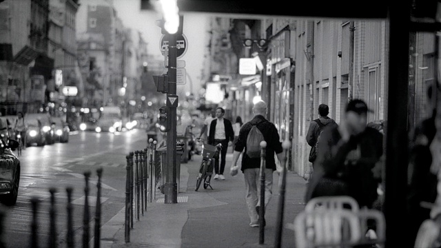 Video Reference: Bicycle, White, Light, Tire, Black, Infrastructure, Human, Street light, Road surface, Black-and-white