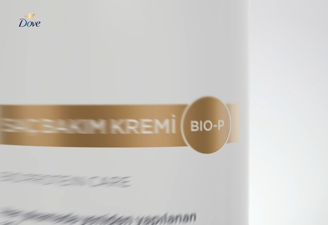 Video Reference: cosmetic, skincare, product packaging, white background, gold label, brand logo, close-up, motion blur, beauty product, container, minimal, commercial, advertising