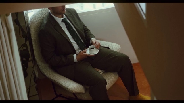 Video Reference: Suit trousers, Comfort, Tie, Eyewear, Collar, Automotive design, Knee, Suit, Thigh, Blazer