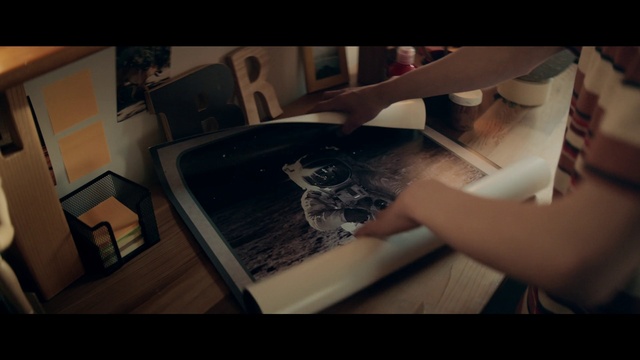 Video Reference: Cloud, Flash photography, Gesture, Table, Finger, Wood, Art, Automotive design, Font, Flooring