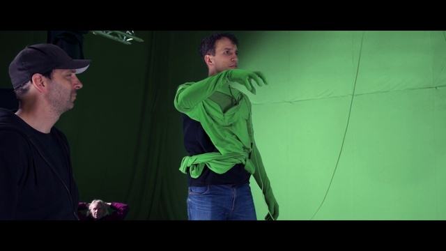 Video Reference: Flash photography, Gesture, Cap, Baseball cap, Elbow, Entertainment, Music artist, Electronic device, Event, T-shirt