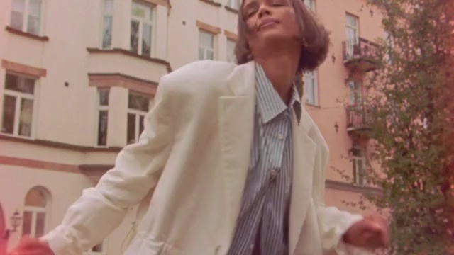 Video Reference: Window, Dress shirt, Textile, Sleeve, Collar, Plant, Blazer, Eyewear, Formal wear, Event