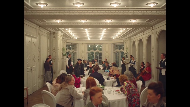 Video Reference: Furniture, Chair, Table, Lighting, Interior design, Social group, Decoration, Suit, Hall, Crowd