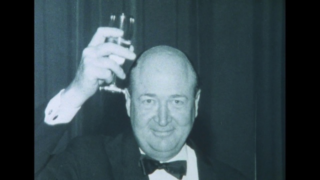 Video Reference: Smile, Jaw, Flash photography, Gesture, Bow tie, Collar, Dress shirt, Suit, Happy, Sign language