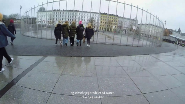 Video Reference: Sky, Building, Urban design, Road surface, Asphalt, Line, City, Facade, Sidewalk, Concrete