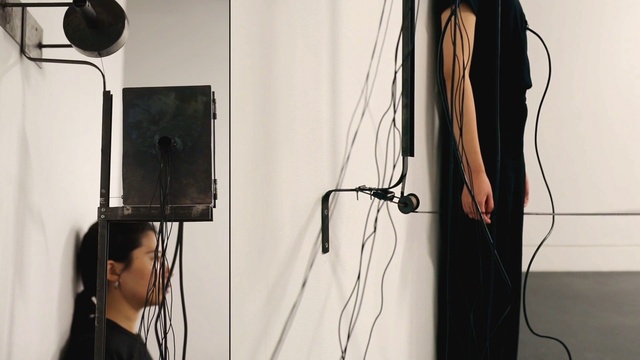 Video Reference: Joint, Hairstyle, Shoulder, White, Black, Standing, Eyelash, Audio equipment, Style, Black hair