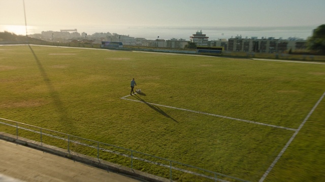 Video Reference: Sky, Sports equipment, Cloud, Soccer, Football, Land lot, Player, Ball, Flooring, Plant