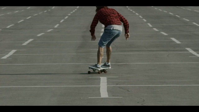 Video Reference: footwear, player, skateboarding equipment and supplies, asphalt, shoe, longboard, skateboard, sport venue, recreation, sports equipment, Person